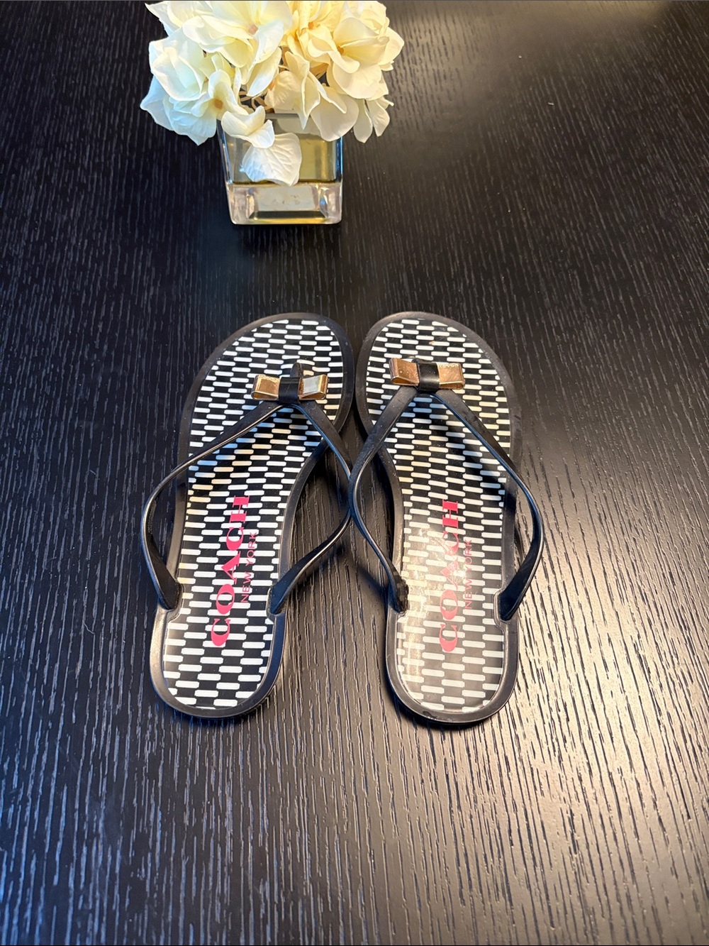 Coach Black Flip Flops with Gold Bow Detail - Picture 2 of 5